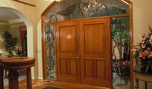Double wood entry doors with stained glass sidelights