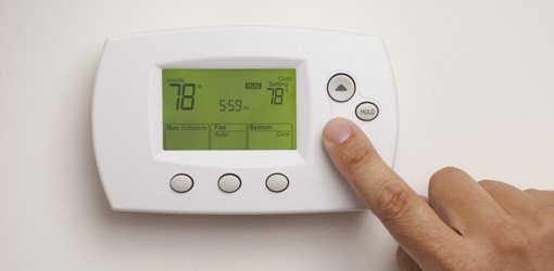 Adjusting a programmable thermostat.