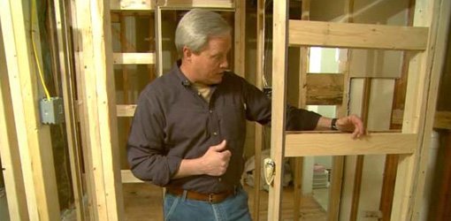 Danny Lipford with framing for pocket doors in new construction.