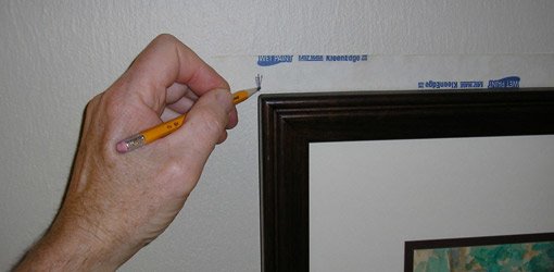 Marking wall even with edge of frame