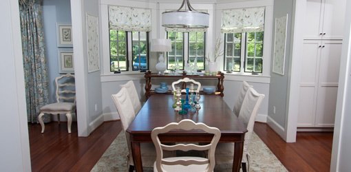 Dining room with hanging chandelier.