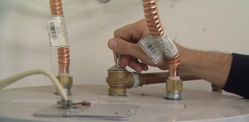 Opening pressure relief valve on top of water heater
