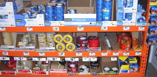 Rolls of different tape on shelves at home center.