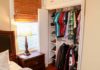Bedroom closet with cubby holes for shoes and racks to hang shirts and jackets