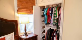 Bedroom closet with cubby holes for shoes and racks to hang shirts and jackets