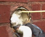 filling crack in brick with insulation