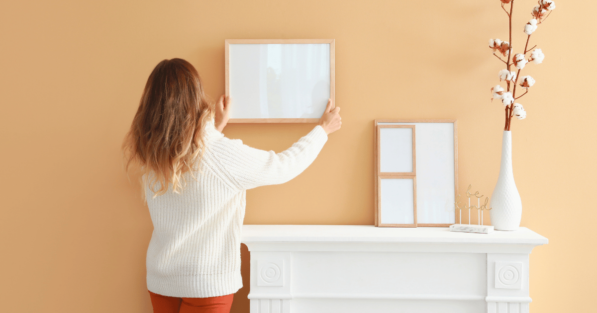 https://todayshomeowner.com/wp-content/uploads/2009/02/woman-hanging-a-picture-frame.png