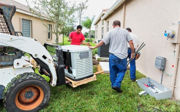 Crew installs an automatic standby generator