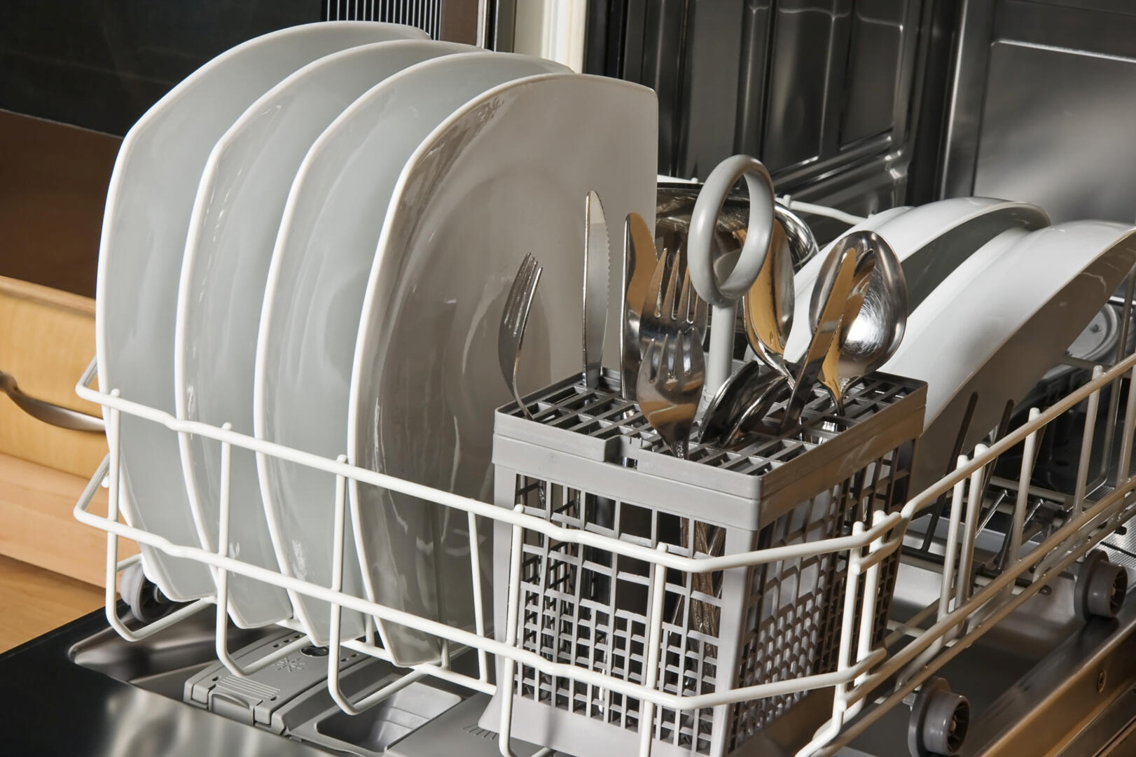 Dishwasher with clean white plates