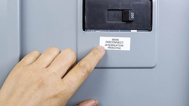 Finger pointing to main circuit breaker