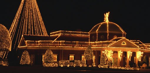 Home outlined in Christmas lights