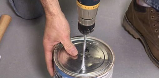 Mixing paint with drill attachement.