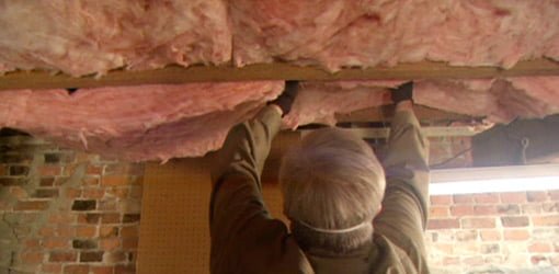 Installing insulation between the joists in a basement