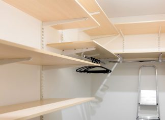Track closet system, seen newly installed, without clothes and items