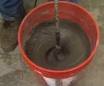 mixing concrete to repair slab