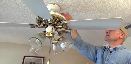 Joe Truini fixing an out of balance paddle ceiling fan.