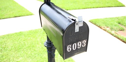 Black mailbox with 6093 number on it.