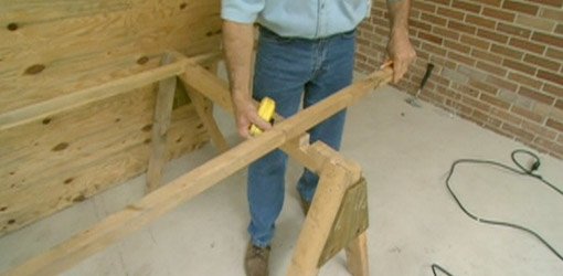 Notches cut in sawhorse top for 2x2 strips