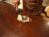 Applying mayonnaise to water stain on furniture