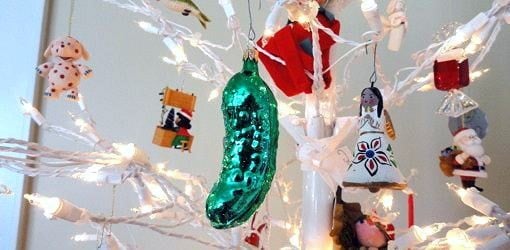 Christmas pickle ornament on tree