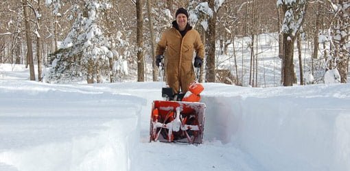 Joe Truini and his Ariens snowblower clearing a path to his door
