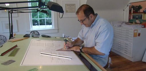Architect Pete J. Vallas drafting plans for house