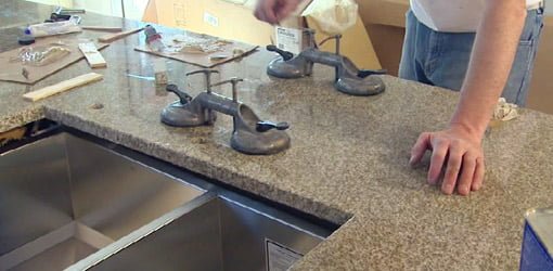 Seams in granite countertops glued and clamped together