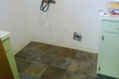 Empty space in laundry room for washer dryer