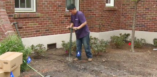 Digging trenches for landscape lighting wiring