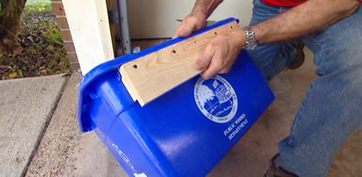 Homemade recycling bin wall cleat on bin
