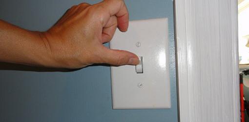Turning new wall switch on and off to test it