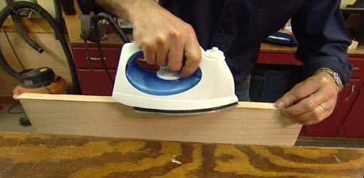 Using a clothes iron to attach edge banding veneer to a plywood edge