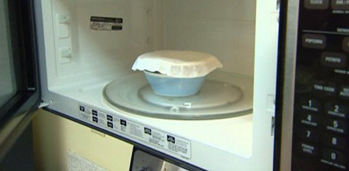 Coffee filter covering bowl in microwave