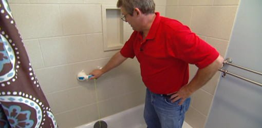 Allen Lyle testing Super Grip Safety Handle in bathroom