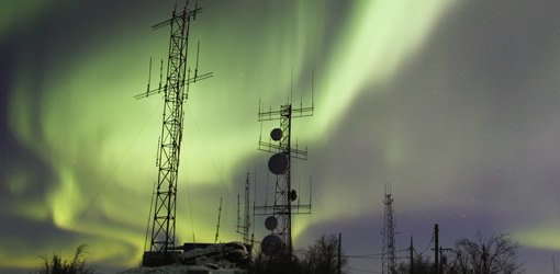 Northern lights over communication towers