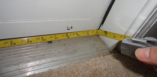 Using tape measure to measure door opening