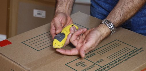 Using a utility knife to open boxes without damaging the contents.