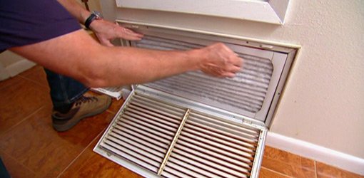 Changing air filter on central air conditioner.