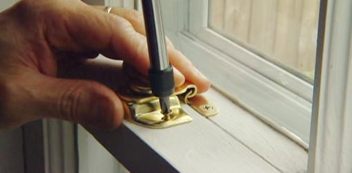 Attaching window latch to window sash.