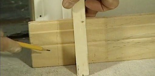 Homemade marking jig for baseboard and other moldings.