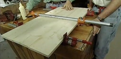 Using pipe clamps to glue boards together.