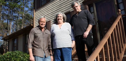 Danny Lipford standing on steps with homeowners Vicki and Russ Baker of Jonesboro, Georgia.