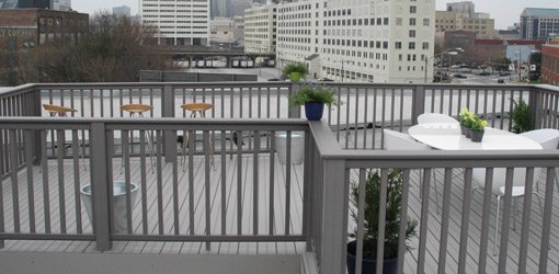 Completed rooftop composite deck and railings.