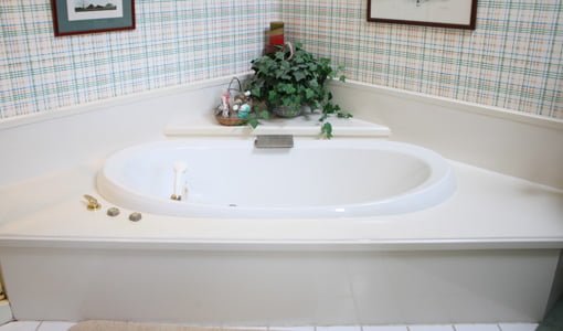 Old master bathroom whirlpool tub before renovation.