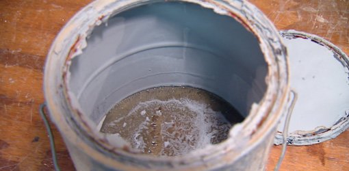 Old paint that has separated due to freezing.