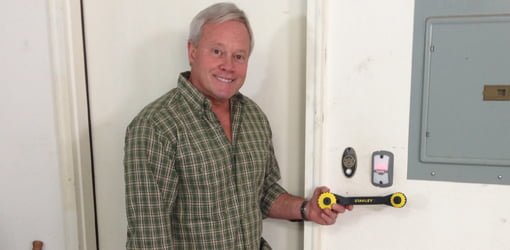 Danny Lipford with Genie garage door opener, Stanley TwinTec adjustable wrench, and NuTone College Pride Doorbell.