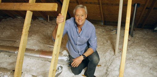 Danny Lipford in attic to inspect roof for leaks.