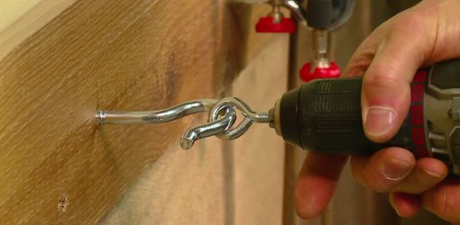 Using drill to power drive a screw hook.