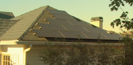 Solar panels generating electricity on the roof of a home.