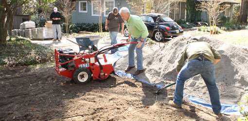 Danny Lipford preparing soil for paver driveway.